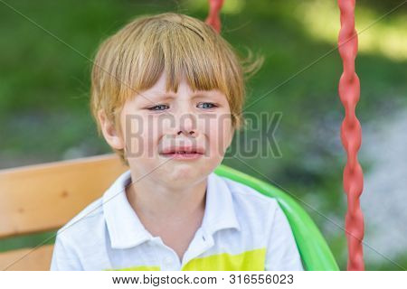 Little Child Boy Crying Sitting On Baby Swing