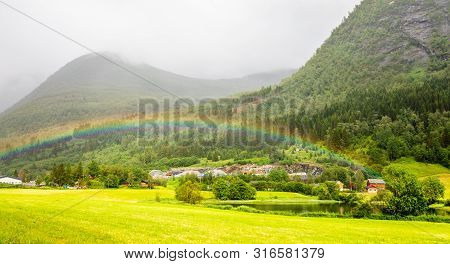 Colorful Rainbow Over The Fields, Lake And Houses Of Skei Village, Jølster In Sogn Og Fjordane Count