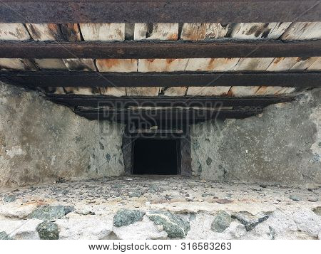 Loophole In Concrete Wall. Concrete Bunker With Embrasure.