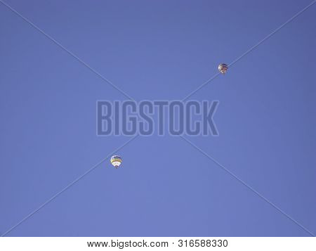 Some Flying Ballons In A Blue Sky