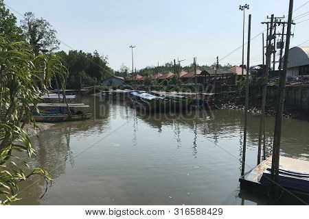 Boat On The River In A Village Of Thailand
