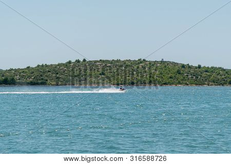 Young Man On Jet Ski, Tropical Ocean, Vacation Concept