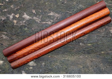 Wood Logs Round Lath Of Burma Padauk, Exotic Wooded Beautiful Pattern For Crafts Or Diy At Blured Ba