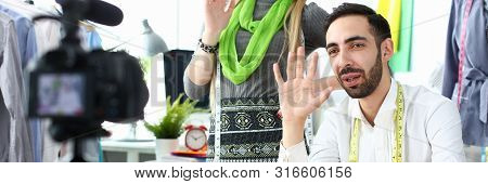 Fashion Clothes Tailoring Internet Vlog Tutorial. Smiling Woman And Joyful Man Designer Waving At Ca