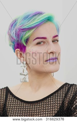 Young Beautiful Woman With Dyed Blue And Green Hair. Pixie Bob Short Haircut The Concept Of Hair Sty