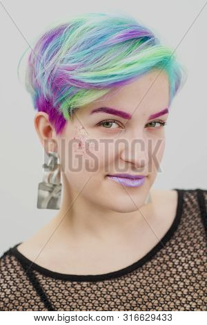 Young Beautiful Woman With Dyed Blue And Green Hair. Pixie Bob Short Haircut The Concept Of Hair Sty