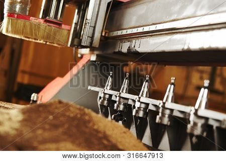 Machine With Numerical Control For Cutting Wood With Various Router Bits.