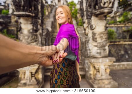 Follow Me Photo. Young Woman Tourist On Background Of Three Stone Ladders In Beautiful Pura Lempuyan