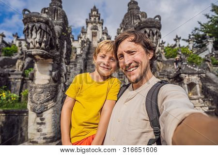 Dad And Son Tourists On Background Of Three Stone Ladders In Beautiful Pura Lempuyang Luhur Temple. 