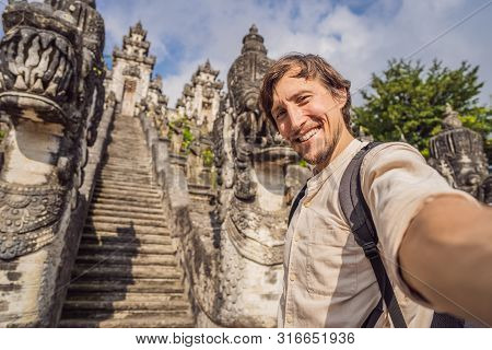 Young Man Tourist On Background Ofthree Stone Ladders In Beautiful Pura Lempuyang Luhur Temple. Summ