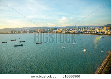 Sanya Town Evening Cityscape, View From Phoenix Island On Hainan Island In China