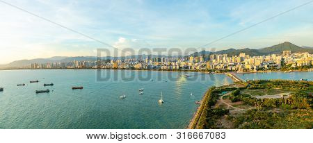 Sanya Town Evening Cityscape, View From Phoenix Island On Hainan Island In China