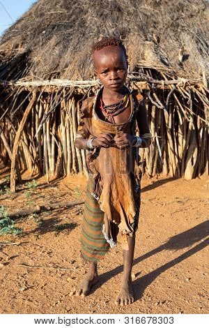 Turmi, Omo River Valley, Ethiopia - May 10, 2019: Portrait Of A Hamar Children In Village. The Hamer