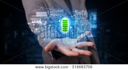 Elegant hand holding battery with full of energy