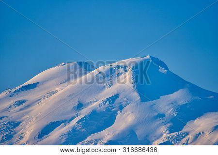 The Tops Of Elbrus At Sunries. North Caucasus, Russia
