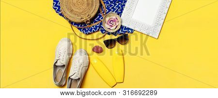 Female Summer Fashion Background. Clothes And Accessories On Yellow Background. Blue Dress, Round Ra