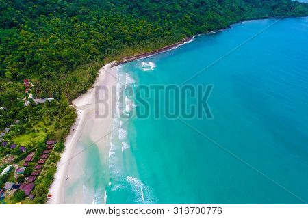 Tropical Sea Wave White Sand Beach With Green Tree Aerial View In Koh Kood