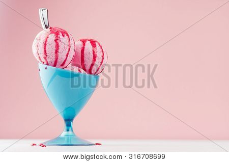 Three Pink Ice Cream Balls In Elegant Blue Plastic Bowl With Strawberry Sauce, Silver Spoon On White
