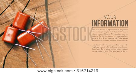 Ceramic Capacitor Radio Components On Wooden Background