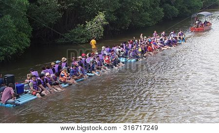 Chantaburi, Laem Sing, Thailand - 26 July 2019 Tourists Floating On Pvc Pipe Raft In The Lake Of Lae