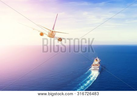 Cruise Ship Goes Into The Open Sea, Plane Flies Into The Sky Horizon In The Evening At Sunset. Trave