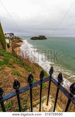 Tenby, Castle Beach And St Catherines Island, In Wales Railings In Foreground