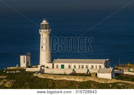 Lighthouse On Rocky Outcrop In Morning Light, Landscape, Telephoto