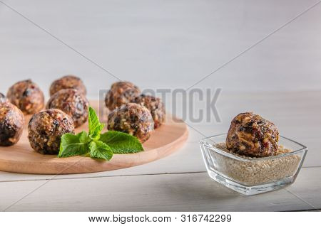Vegetarian Food, Energy Balls Of Walnuts, Dates, Prunes, Cranberries, Honey With Sesame