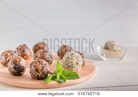 Vegetarian Food, Energy Balls Of Walnuts, Dates, Prunes, Cranberries, Honey With Sesame