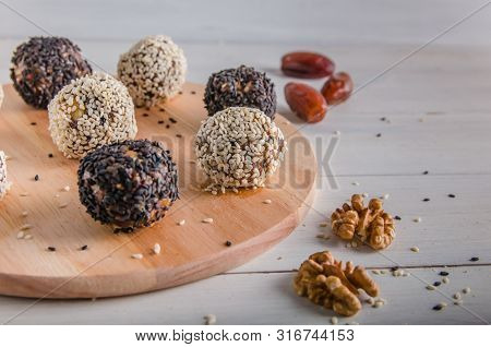 Vegetarian Food, Energy Balls Of Walnuts, Dates, Prunes, Cranberries, Honey With Sesame