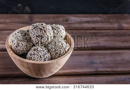 Vegetarian Food, Energy Balls Of Walnuts, Dates, Prunes, Cranberries, Honey With Sesame