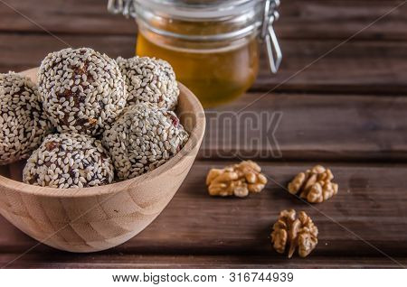 Vegetarian Food, Energy Balls Of Walnuts, Dates, Prunes, Cranberries, Honey With Sesame