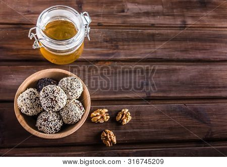 Vegetarian Food, Energy Balls Of Walnuts, Dates, Prunes, Cranberries, Honey With Sesame