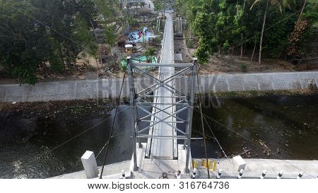 A Suspension Bridge Crosses The River. Supporting Inter-regional Transportation Facilities. Traffic 