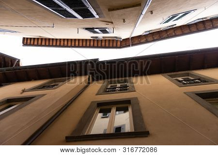 The Town Of Barga. Italy. Summer 2019. Street In The Central Part Of The Historic Center. Roofs On A