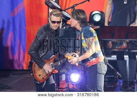 NEW YORK - AUG 9: Keith Urban (R) and Danny Rader perform on ABC's 