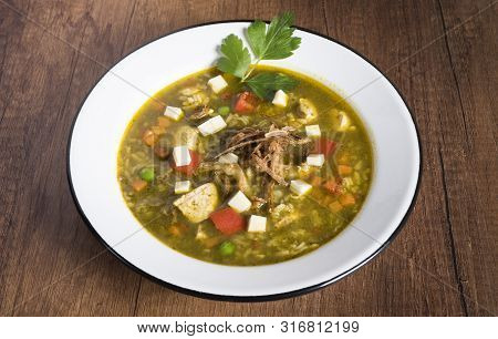 Peruvian Cilantro Chicken Soup Or Aguadito De Pollo With Yukon Gold Potatoes Corn On The Cob And Lim