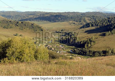 Taiga Village Generalka In The Mountains Of Altai Krai. Western Siberia. Russia