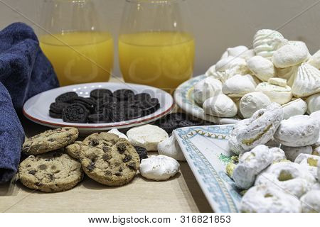 Rich, But A Lot Of Sugar On This Table Of Sweets And Natural Orange Juice
