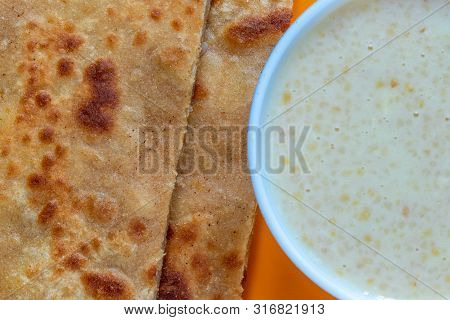 Egg Paratha With Dalia Or Daliya, Cereal Food Know As Bulgur Cooked In Milk Served With Egg Stuffed 