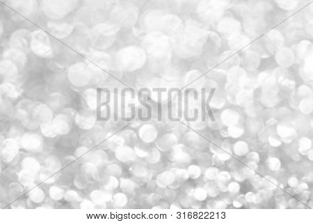 Sillver Bokeh Texture. Festive Glitter Background With Defocused Lights