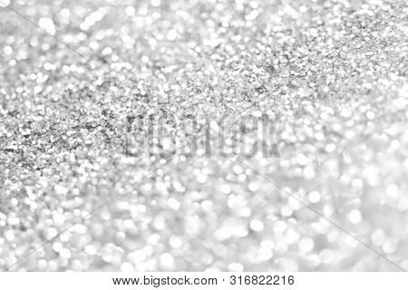 Sillver Bokeh Texture. Festive Glitter Background With Defocused Lights