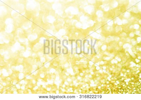 Gold Bokeh Texture. Festive Glitter Background With Defocused Lights