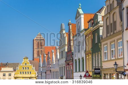 Wismar, Germany - April 19, 2019: Colorful Historic Facades At The Market Square Of Wismar, Germany