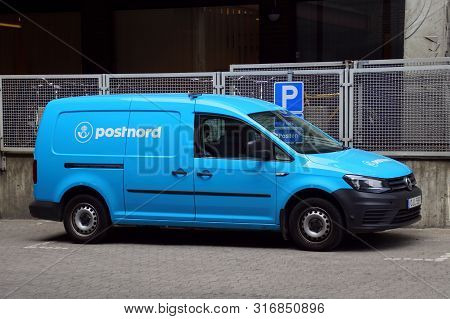 Malmo, Sweden - July 22, 2019: Blue Postnord Delivery Van Parked On A Public Parking Lot. Nobody In 