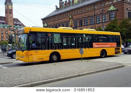 Copenhagen, Denmark - July 20, 2019:  Yellow Public Transport Bus In The City Of Copenhagen.