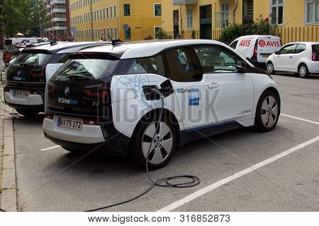 Copenhagen, Denmark - July 20, 2019: Drivenow Bmw I3 Electric Car Being Charged On  A Public Parking