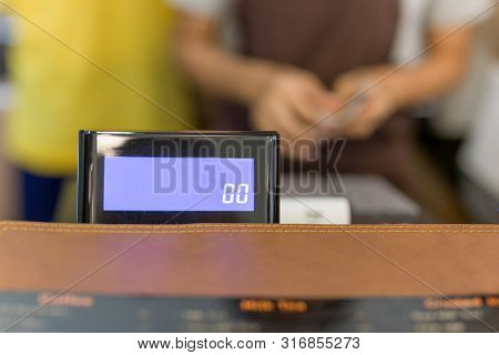 Selected Focus Cashier Register With Female Waitress Operating In Cafe.