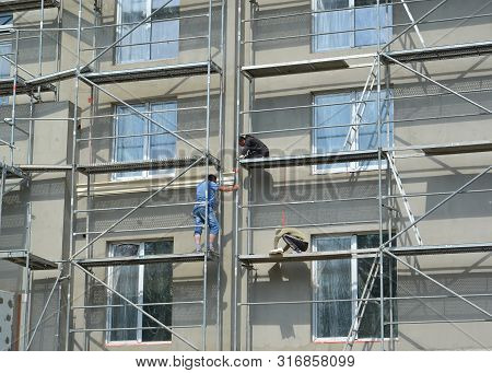 Kaliningrad, Russia - July 28, 2019: Finishing Of A Facade Of A Multystoried House