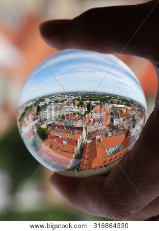 Lens Ball With Reflection Of Hradec Kralove City At Morning Light From White Tower. Sky With White C